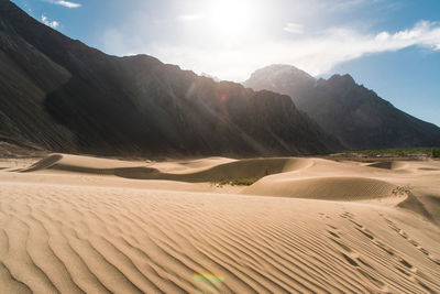 Desert and mountain against sky