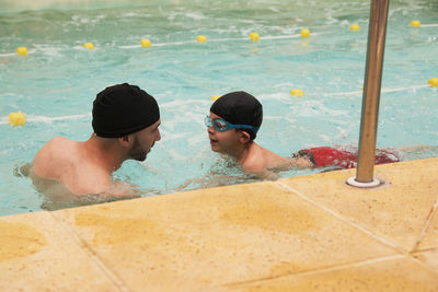 Portrait of little boy learning to swim