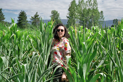 Portrait of woman standing on field