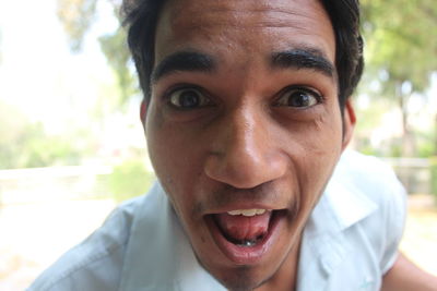 Close-up portrait of smiling young man