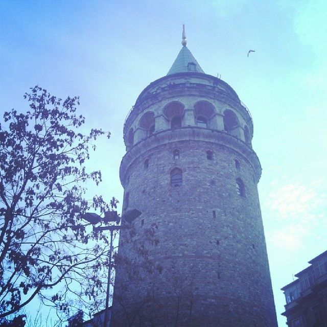 architecture, built structure, building exterior, low angle view, tower, famous place, history, religion, place of worship, clear sky, sky, blue, travel destinations, spirituality, tall - high, church, tourism, travel, international landmark