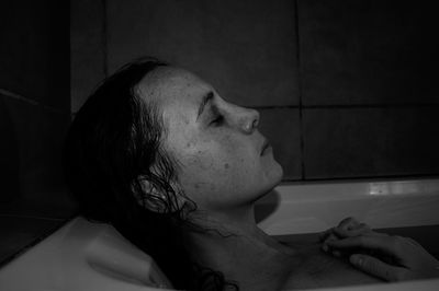 Portrait of young woman in bathroom