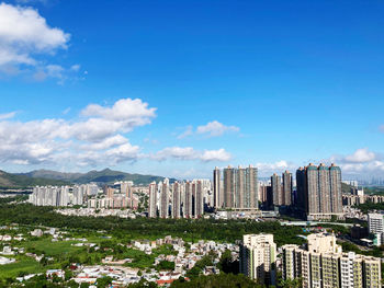 Modern buildings in city against sky