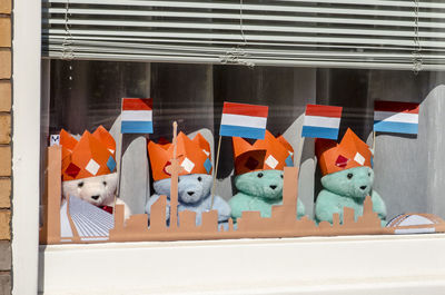 Bears with flags in window