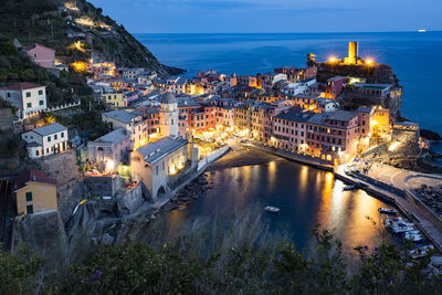 High angle view of illuminated buildings in city