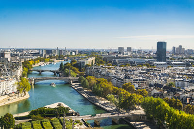  view on paris from roof of notre dame cathedral on bright sunny day