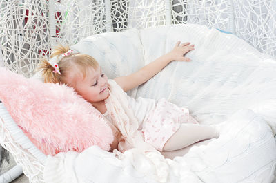 High angle view of girl on bed