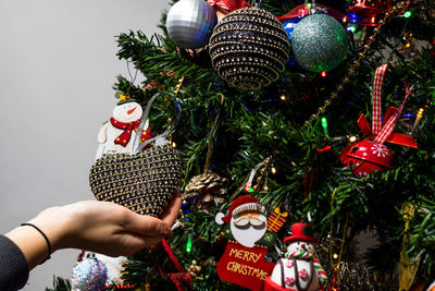 Close-up of christmas ornaments on tree