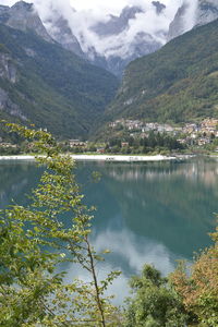 Scenic view of lake and mountains against sky