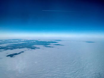 Scenic view of sea against sky during winter