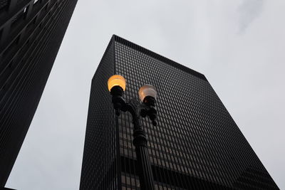 Low angle view of dark skyscraper