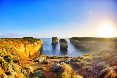 Scenic view of sea against clear blue sky