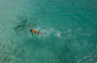 High angle view of man swimming in sea