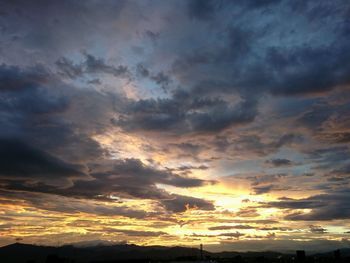 Low angle view of dramatic sky during sunset