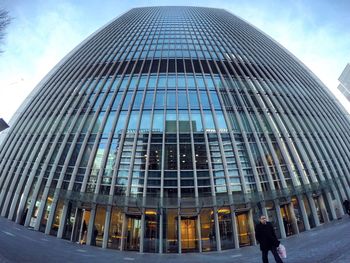 Low angle view of office building against sky