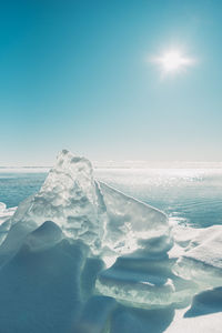 Scenic view of sea against clear sky during winter