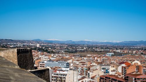 High angle shot of townscape against clear blue sky