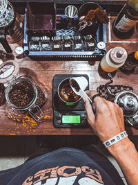 High angle view of man using coffee on table