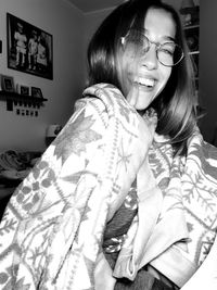 Young woman smiling at home