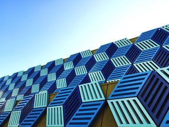 Low angle view of building against clear blue sky