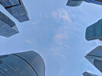 Low angle view of modern buildings against sky