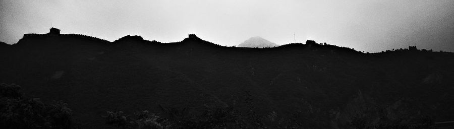 Scenic view of mountains against sky at sunset