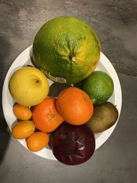 Fruits in plate on table