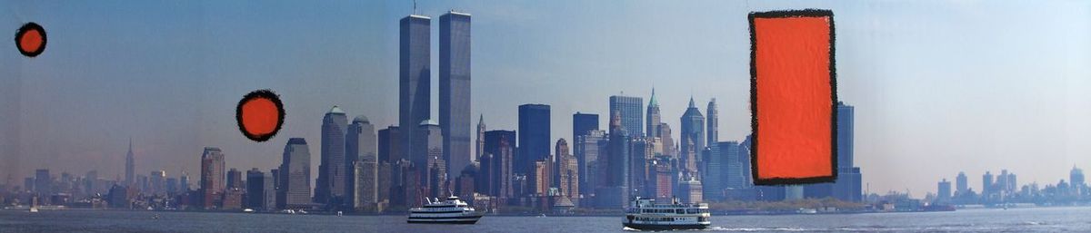 Panoramic view of city buildings against sky