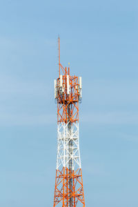 Low angle view of communications tower against sky