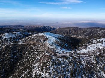 High angle view of snowcapped mountain against sky