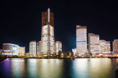 Illuminated buildings in city at night