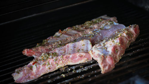 High angle view of meat on barbecue