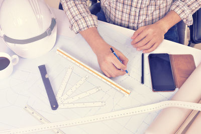 High angle view of person working on table