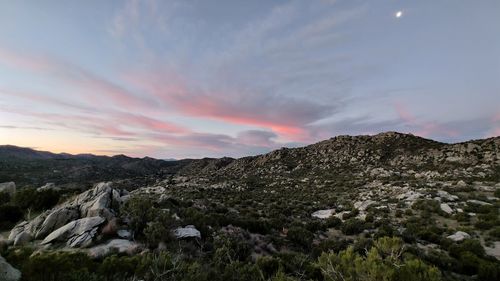 Scenic view of mountains against sky during sunset