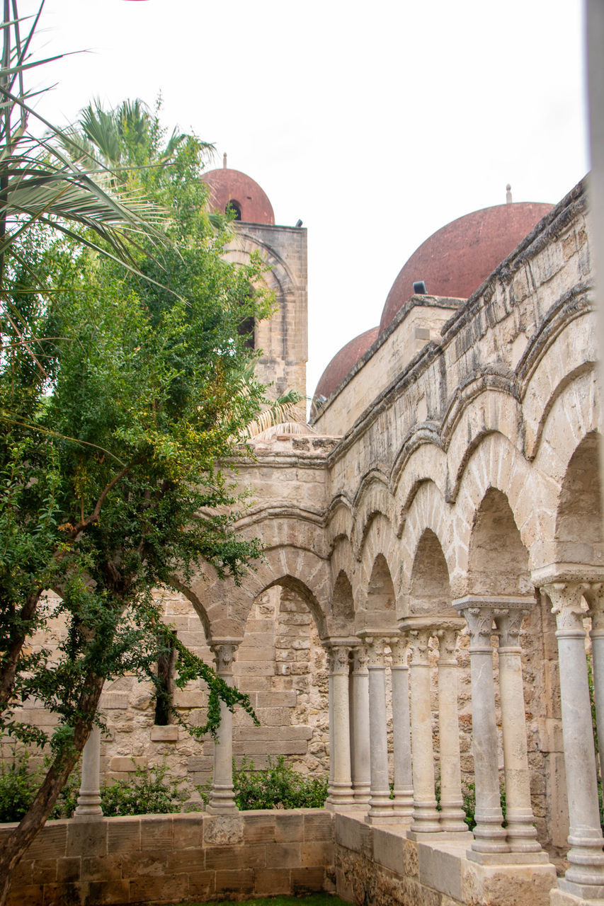 architecture, built structure, history, arch, building exterior, the past, tree, plant, travel destinations, nature, building, travel, tourism, place of worship, sky, religion, no people, day, outdoors, courtyard, city, estate, ancient, architectural column, ancient history, palace, belief