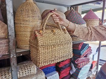 Close-up of woman holding basket at store