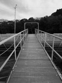 Footbridge against sky