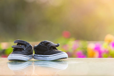 Close-up of shoes on table