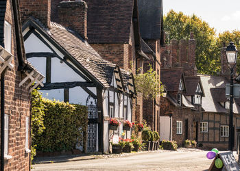 Street by buildings in a quaint english village