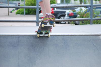 Low section of man skateboarding at park