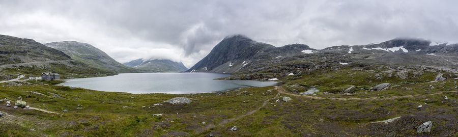 Scenic view of lake and mountains against sky