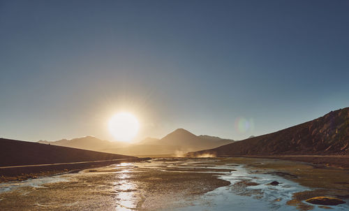 Scenic view of sea against clear sky during sunset