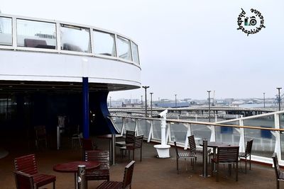 View of restaurant by sea against clear sky