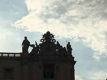 Low angle view of statue against building