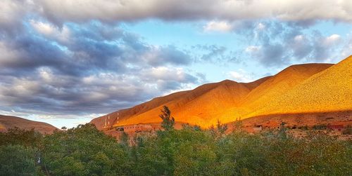 Panoramic view of landscape against cloudy sky