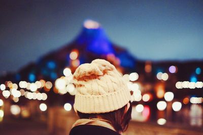 Woman standing at night