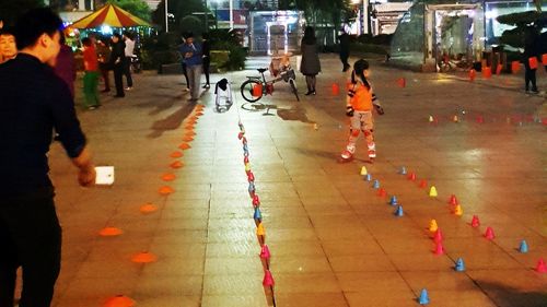 People walking on road in city