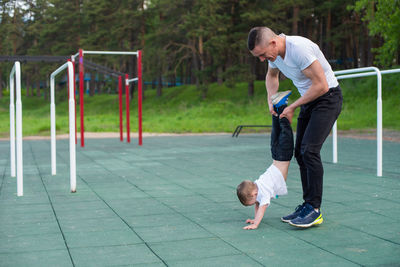 Full length of man playing with ball