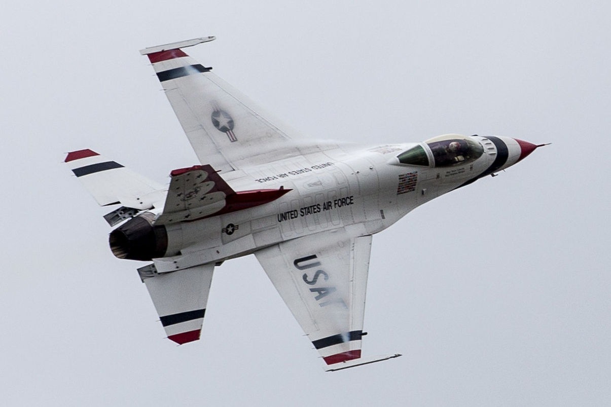 AIRPLANE FLYING AGAINST WHITE BACKGROUND