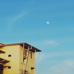 Low angle view of building against blue sky